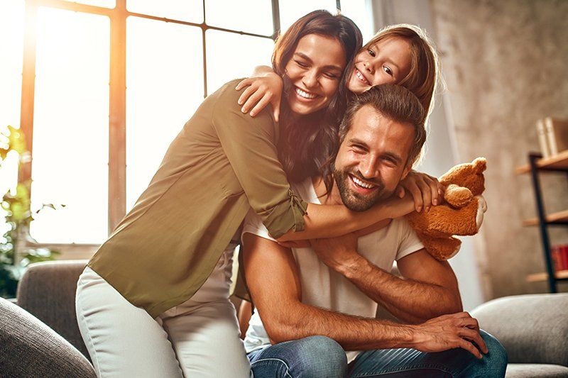 Family with a teddy bear — Grapevine, TX — Silvas Law, PC